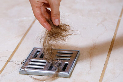 The Science Behind Drain Clogs: Understanding the Role of Hair and Debris in Blocked Pipes